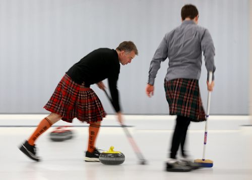 Dennis Cunningham and Kevin Morris from team McACU Tartan Terrors, sweeping during the Lite's Hurry Hard charity curling funspiel at the Thistle Curling Club, Saturday, March 21, 2015. (TREVOR HAGAN/WINNIPEG FREE PRESS)