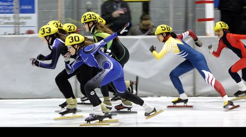 Skaters take off from the starting line in a race at Speed Skating Canadas National Western Short Track Championships Sunday afternoon in Selkirk, MB.   150322 March 22, 2015 Mike Deal / Winnipeg Free Press