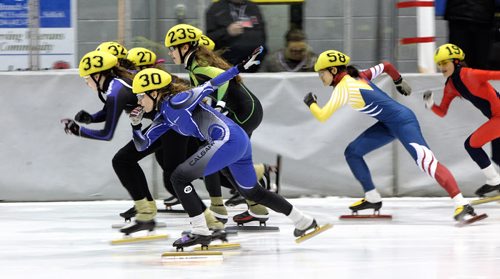 Skaters take off from the starting line in a race at Speed Skating Canadas National Western Short Track Championships Sunday afternoon in Selkirk, MB.   150322 March 22, 2015 Mike Deal / Winnipeg Free Press