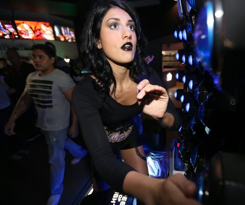 Katy Ruiz, 21, playing Speed of Light, an arcade game at Reset Interactive Ultralounge, Saturday, March 14, 2015. (TREVOR HAGAN/WINNIPEG FREE PRESS)