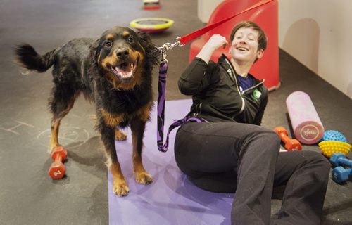 Carly Lodewyks gets distracted from her playful dog Ember as they attend their first class at Woof and Wags on Sunday. Sarah Taylor / Winnipeg Free Press March 22, 2015