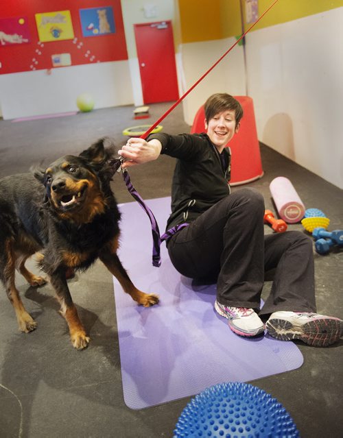 Carly Lodewyks gets distracted from her playful dog Ember as they attend their first class at Woof and Wags on Sunday. Sarah Taylor / Winnipeg Free Press March 22, 2015