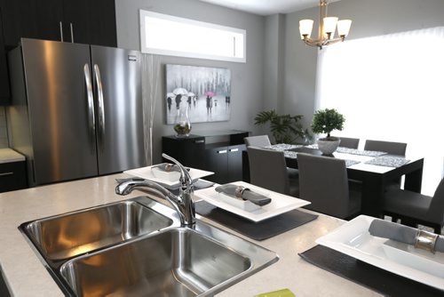 Homes. 81 Angela Everts Drive in Crocus Meadows, Derek MacDonald with Qualico Homes is the contact. Sink in island with dining area in back.Todd Lewys story Wayne Glowacki/Winnipeg Free Press March 23 2015
