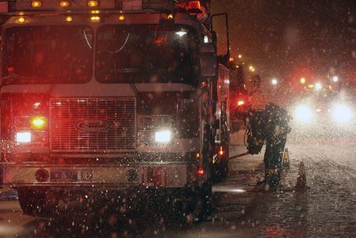 Firefighters battled a blaze at the Stirling Apartments at 573 Sherbrook Monday morning in heavy snow- The whole building was evacuated as crews extinguished the blaze -Standup Photo- Mar 23, 2015   (JOE BRYKSA / WINNIPEG FREE PRESS)