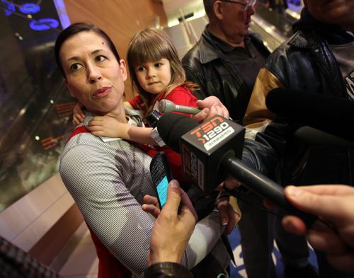 Welcoming Committee -  Team Canada's curling mom Jennifer Officer and her patiently long waiting daughter Camryn (3) answer media questions as Officer arrived home from Japan with her silver championship medal. See Paul Wiecek's story. March 23, 2015 - (Phil Hossack / Winnipeg Free Press)