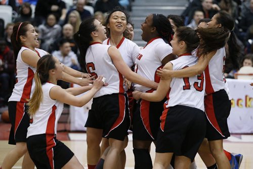 March 23, 2015 - 150323  -  Sisler Spartans celebrate a win over the Oak Park Raiders in the girls Manitoba High School AAAA Basketball Championship game at the U of Winnipeg Monday, March 23, 2015. John Woods / Winnipeg Free Press