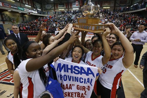 March 23, 2015 - 150323  -  Sisler Spartans celebrate a win over the Oak Park Raiders in the girls Manitoba High School AAAA Basketball Championship game at the U of Winnipeg Monday, March 23, 2015. John Woods / Winnipeg Free Press