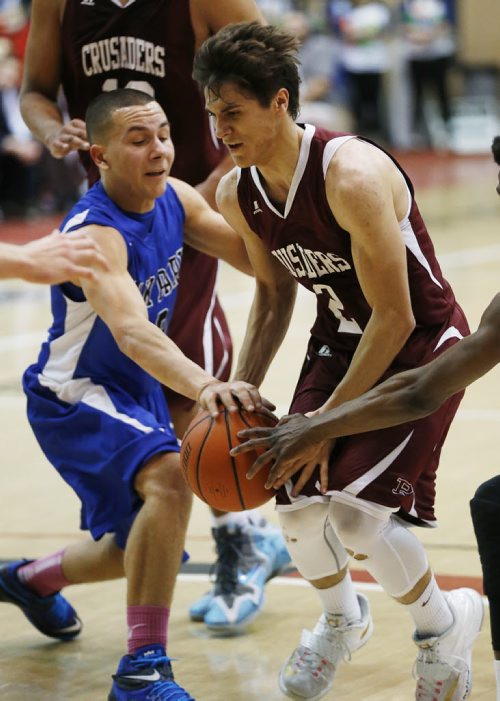 March 23, 2015 - 150323  -  Oak Park Raiders' Ethan Diakow (9) defends against St Paul's Crusaders' Arpad Farkas (2) in the boys Manitoba High School AAAA Basketball Championship game at the U of Winnipeg Monday, March 23, 2015. John Woods / Winnipeg Free Press