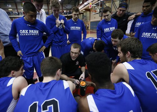 March 23, 2015 - 150323  -  Oak Park Raiders coach Jon Lundgren talks to his players during a timeout against the St Paul's Crusaders in the boys Manitoba High School AAAA Basketball Championship game at the U of Winnipeg Monday, March 23, 2015. John Woods / Winnipeg Free Press