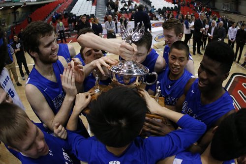 March 23, 2015 - 150323  -  Oak Park Raiders celebrate after defeating the St Paul's Crusaders in the boys Manitoba High School AAAA Basketball Championship game at the U of Winnipeg Monday, March 23, 2015. John Woods / Winnipeg Free Press