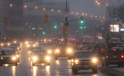 Misty Morning-Cars make the morning commute on Portage Ave Tuesday through light rain- Standup Photo- Mar 24, 2015   (JOE BRYKSA / WINNIPEG FREE PRESS)