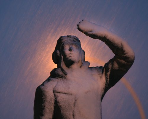 The Airman in Training memorial statue on Memorial Blvd appears to be blocking the wet snow as it blows in sideways with near 50 Km/hr winds in Winnipeg Wednesday morning- Standup Photo- Mar 25, 2015   (JOE BRYKSA / WINNIPEG FREE PRESS)