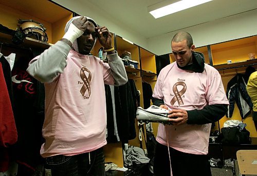 BORIS MINKEVICH / WINNIPEG FREE PRESS  071011 University of Manitoba Bisons Randy Simmons and Terry Firr wear pink in support of women with cancer.