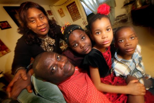 Gibril and Ann Marie Bangura with their 3 kids ( left to right) Esther 9, Veralina 5 and  Moses 7.  The refugees from Sierra Leone arrived in Canada last February and were shown the ropes by a Wpg family they met through IRCOMs Family-to-Family program. Gibril is an artist who now does exhibitions and gives lectures thanks to the confidence he says he got from hanging out with the Wpg family (Kristen Pachet, her husband Joel Savard, and their two children see their portrait) who took them under their wing. See Carol Sanders story. (March 25, 2015 - (Phil Hossack / Winnipeg Free Press)