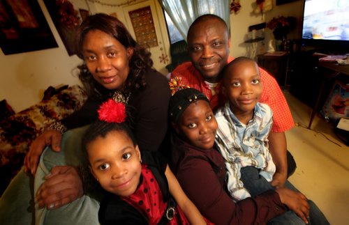 Gibril and Ann Marie Bangura with their 3 kids ( left to right) Veralina 5, Esther 9, and  Moses 7.  The refugees from Sierra Leone arrived in Canada last February and were shown the ropes by a Wpg family they met through IRCOMs Family-to-Family program. Gibril is an artist who now does exhibitions and gives lectures thanks to the confidence he says he got from hanging out with the Wpg family (Kristen Pachet, her husband Joel Savard, and their two children see their portrait) who took them under their wing. See Carol Sanders story. (March 25, 2015 - (Phil Hossack / Winnipeg Free Press)