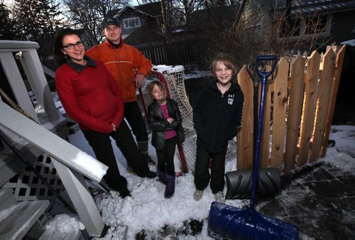 Left to right, Kristen Pachet, her husband Joel Savard, and their two children Thalia 5 and Loic 9 who were teamed with refugees Gibril and Ann Marie Bangura with their 3 kids by IRCOM. See Carol Sanders story. March 25, 2015 - (Phil Hossack / Winnipeg Free Press)