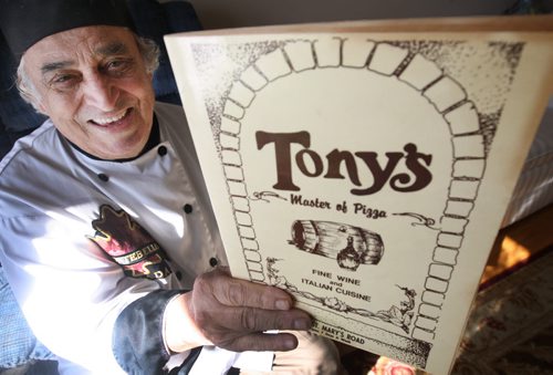 83-year-old Tony Rampone - the Tony in Tony's Master of Pizza shows a menu from original restaurant-See Daves 49.8 feature- Mar 26, 2015   (JOE BRYKSA / WINNIPEG FREE PRESS)