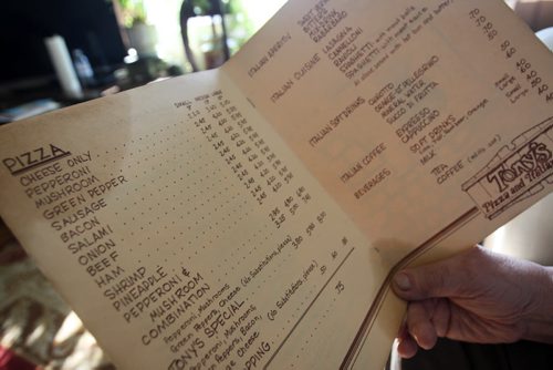 83-year-old Tony Rampone - the Tony in Tony's Master of Pizza looks over a menu from original restaurant-See Daves 49.8 feature- Mar 26, 2015   (JOE BRYKSA / WINNIPEG FREE PRESS)