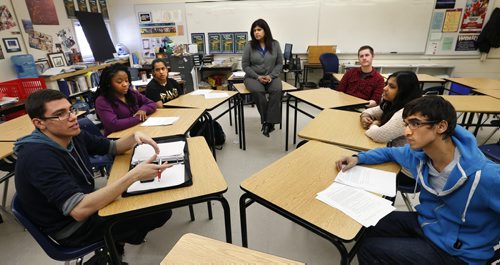 River East Collegiate students from left, Emmanuel Cardozo, Jayda Hope, Quiana Kumar, teacher Anita Maharaj Kumar, James Pither, Kaela Rampersad and Kartik Sachar are going to the US to compete in an ethics bowl, in which they examine and discuss the ethical aspects of real-life situations. Nick Martin story Wayne Glowacki/Winnipeg Free Press March 26 2015