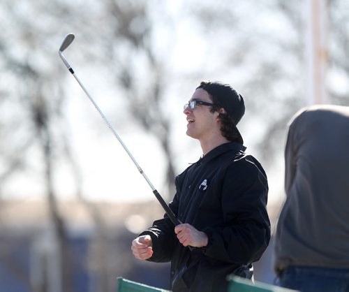 It's tee time again as golfers like  Eason Cerasani brave the cool spring day to hit a basket of balls at Shooters Family Gold Centre Thursday afternoon.  The driving range has been open for a couple of weeks and the owner says that if the temperature is a couple degrees above zero golfers will show up to brush up on their game.   Standup photo Ruth Bonneville / Winnipeg Free Press March 26, 2015