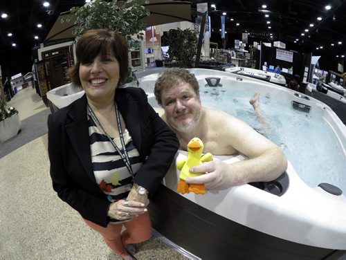 Doug, pictured with Show Manager Jan Currier enjoys a dip in one of the hot tubs at the annual Home Expressions Home and Garden show, which happens this weekend at RBC Convention Centre. March 27, 2015 Tyler Walsh / Winnipeg Free Press