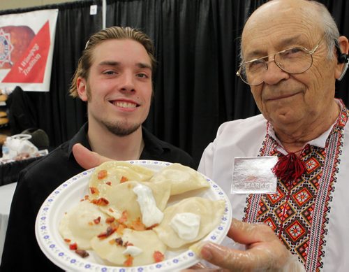 PERFECT PIEROGIES at the Home Expression Show at the convention centre. James Aitkenhead and Lawrence Porhownik with some product they are smiling to the public. BORIS MINKEVICH/WINNIPEG FREE PRESS MARCH 27, 2015