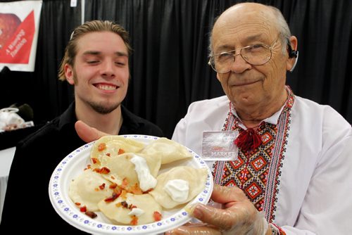 PERFECT PIEROGIES at the Home Expression Show at the convention centre. James Aitkenhead and Lawrence Porhownik with some product they are smiling to the public. BORIS MINKEVICH/WINNIPEG FREE PRESS MARCH 27, 2015