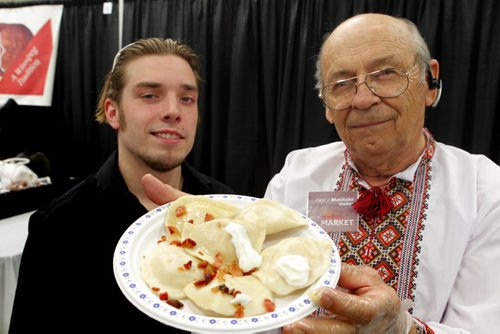 PERFECT PIEROGIES at the Home Expression Show at the convention centre. James Aitkenhead and Lawrence Porhownik with some product they are sampling to the public. BORIS MINKEVICH/WINNIPEG FREE PRESS MARCH 27, 2015