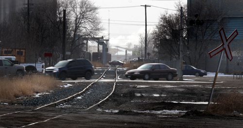 One of the many spur lines radiating out from the the CP rail yards and the city center. See story. March 27, 2015 - (Phil Hossack / Winnipeg Free Press)