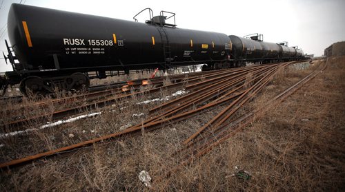 CP Rail yards in the city center and a train made up of oil tanker cars flowing through the city center. See story. March 27, 2015 - (Phil Hossack / Winnipeg Free Press)