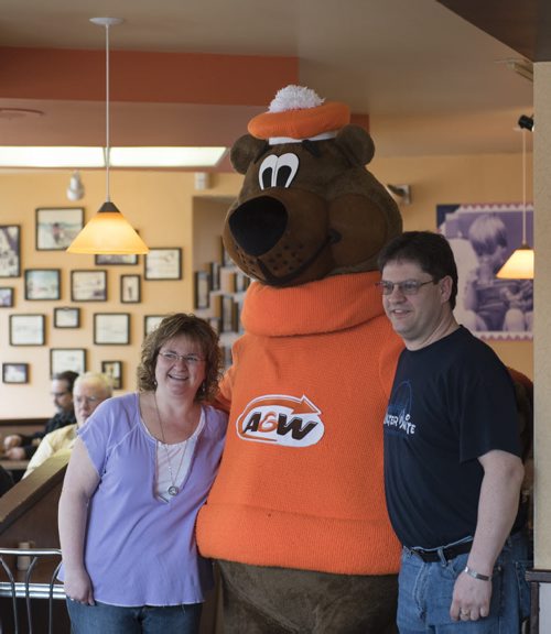 150328 Winnipeg - DAVID LIPNOWSKI / WINNIPEG FREE PRESS  Brenda and Ian McCarthy have been married since 1994, and met at the Kirkfield A&W on Portage Ave. Brenda worked there, and Ian was a regular. The two stopped into the location on their wedding day,  and Root Bear the mascot came dressed as such at their wedding. This A&W was the first to open in Canada back in 1956 and Sunday March 28, 2015 was the last day of business. They are relocating to Portage & Sturgeon on April 9, 2015.