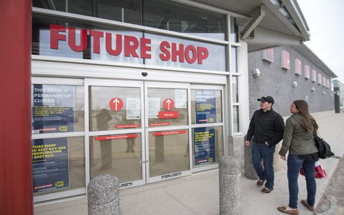 150328 Winnipeg - DAVID LIPNOWSKI / WINNIPEG FREE PRESS  All Futureshop stores across the country were closed this morning, including this store located on St. James Ave., with many reopening next week as Best Buy stores. Customers and employees showed up to locked doors.