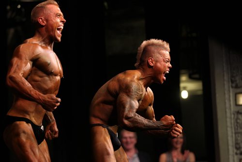 Colin Bryant (left)  and James Balmes (right)  have some fun as they show off their pipes to the audience while competing in the  Mens  light middleweight category during the Manitoba Bodybuilding  Association Provincial Qualifier competition at Pantages Saturday night.  March 28, 2015 Ruth Bonneville / Winnipeg Free Press.