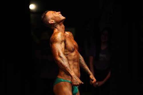 A Body builder competes in the Manitoba Bodybuilding Association Provincial Qualifier competition at Pantages Saturday night.  March 28, 2015 Ruth Bonneville / Winnipeg Free Press.