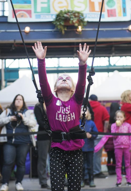 Dasha Levterov, 8,is ready to take off on the trapeze at the Festival of Fools at the Forks on Sunday. Sarah Taylor / Winnipeg Free Press