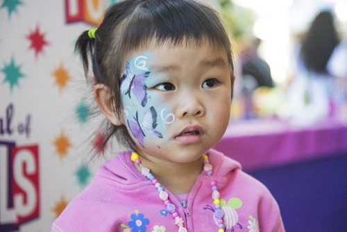 Chang Lu, 2 and a half, poses after she gets her face painted at the Festival of Fools at the Forks on Sunday. Sarah Taylor / Winnipeg Free Press