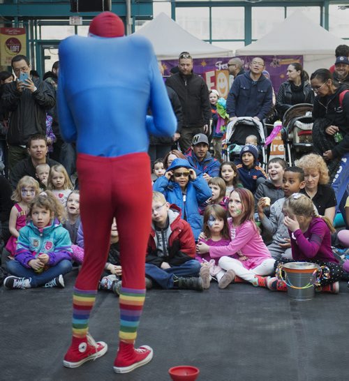 Kids prepare themselves for Gustavo the Impossibilist performance at the Festival of Fools at the Forks on Sunday. Sarah Taylor / Winnipeg Free Press