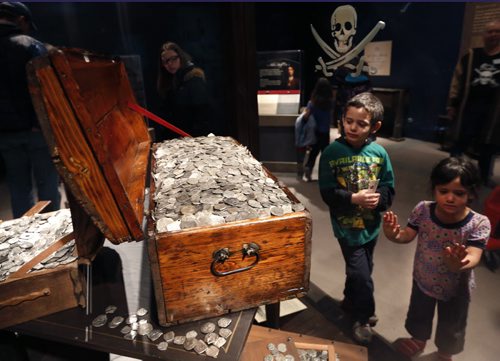 Sara,3, and brother David Gabra,5, check out the display Monday of over  a half million dollars worth of silver coins part of the the Real Pirates: The Untold Story of the Whydah from Slave Ship to Pirate Ship touring exhibition at The Manitoba Museum until April 19. There are over 200 artifacts on display from the  pirate ship that sank off the coast of Cape Cod nearly 300 years ago.  Wayne Glowacki/Winnipeg Free Press March 30  2015