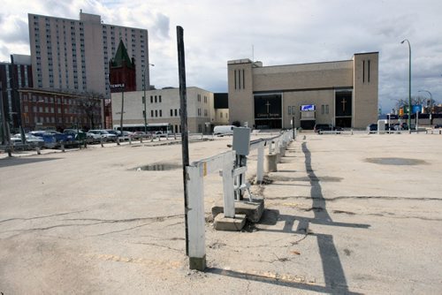 HYDRO "LAND SWAP": Two commercial buildings at 312-318 Notre Dame near downtown , not pictured, and this surface lot nearby will be a new Manitoba Hydro station under a three-way land deal involving the Crown corp, Calvary Temple and a private holding company. See Bartley Kives story - Mar 30, 2015   (JOE BRYKSA / WINNIPEG FREE PRESS)