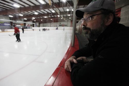 March 30, 2015 - 150330  -  Troy Titterson watches his son Finley play at a spring hockey camp Gateway Arena Monday, March 30, 2015. A recent study shows that hockey helmets are not good at protecting against concussions. John Woods / Winnipeg Free Press