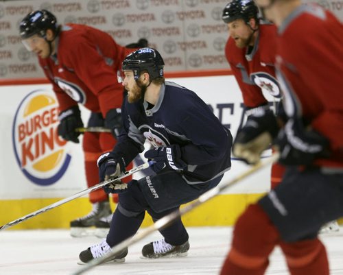 Winnipeg Jets Bryan Little , centre, works hard in the morning skate at the MTS Centre Tuesday morning with his teammates- The Jets will play against the New York Rangers tonight-See Ed Tait story- Mar 31, 2015   (JOE BRYKSA / WINNIPEG FREE PRESS)
