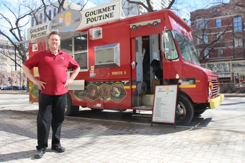Derek Collins, owner of The Poutine King and serves as president of the Winnipeg Food Truck Association. Hed prefer to see a monthly parking pass. March 31, 2015  (BARTLEY KIVES/WINNIPEG FREE PRESS)