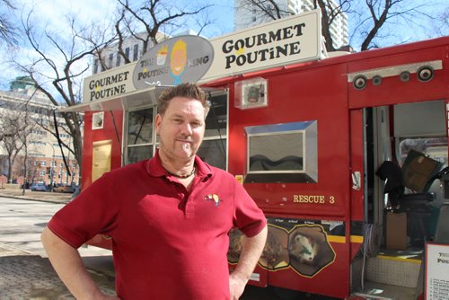 Derek Collins, owner of The Poutine King and serves as president of the Winnipeg Food Truck Association. Hed prefer to see a monthly parking pass. March 31, 2015  (BARTLEY KIVES/WINNIPEG FREE PRESS)