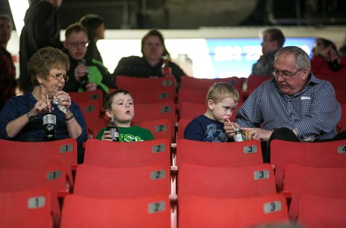 Adrian (left) and Brady Flett enjoys snacks during a horse jumping show with their grandparents Sandra and Barry Todd the morning Royal Manitoba Winter Fair in Brandon, Manitoba March 30, 2015 at the Keystone Centre.  150330 - Monday, March 30, 2015 - (Melissa Tait / Winnipeg Free Press)