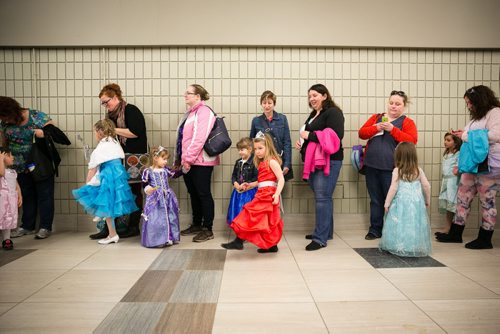Young girls dressed as Princesses wait with their mothers for the sold out Royal Tea Party on the opening day of the Royal Manitoba Winter Fair in Brandon, Manitoba March 30, 2015. 150330 - Monday, March 30, 2015 - (Melissa Tait / Winnipeg Free Press)