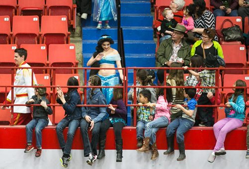 Kids turn to see a performer dressed as Jasmine from Disney's Aladdin before the start of the Super Dogs Show at Royal Manitoba Winter Fair in Brandon, Manitoba March 30, 2015 at the Keystone Centre.  150330 - Monday, March 30, 2015 - (Melissa Tait / Winnipeg Free Press)
