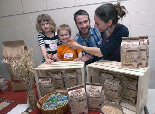 Food Matters Manitoba is hosted a speed networking event to try and match up local farmers and food processors who have products  that they want to sell locally with local retailers and restaurant operators who want to either feature more  locally-produced food in their stores or restaurants.- Here Amy Nikkel and her husband Donald and their children Eli and Alexis( Girl) from Adagio Acres from near Lundar, Manitoba who produce Naked Oats which is sold in some stores and served in local restaurants- See Murray McNeil story- Apr 01, 2015   (JOE BRYKSA / WINNIPEG FREE PRESS)