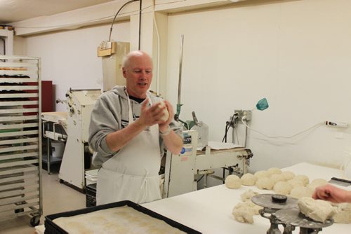 BILL REDEKOP/WINNIPEG FREE PRESS April 1, 2015  021 - Me stretching dough to make rye bread, at 6:30 a.m. at Parkland Bakery in Roblin.