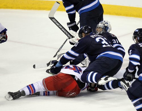 1 of 5 photos.....In a controversial check, Dustin Byfugien winds up to cross checkNew York Ranger's Miller. March 31, 2015 - (Phil Hossack / Winnipeg Free Press)