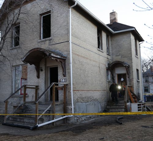 Fire Investigators at the scene of a house fire in the 300 block of Selkirk Ave. early Thursday morning. Occupants escaped without injury from the blaze that broke out aprox. 4:30A.M. Wayne Glowacki/Winnipeg Free Press April 2 2015